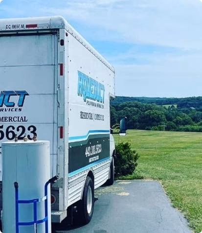 Professional plumber from Aqueduct Plumbing inspecting home water system